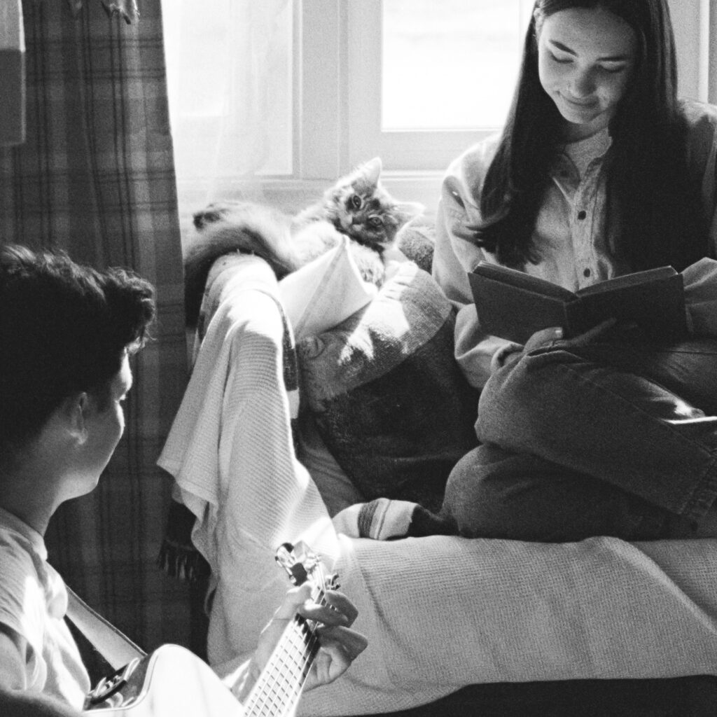 cozy couple with cat on couch