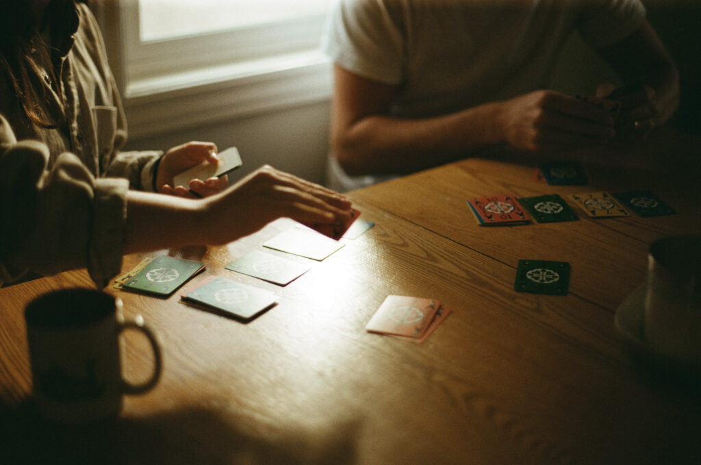 couple playing cards shot on film