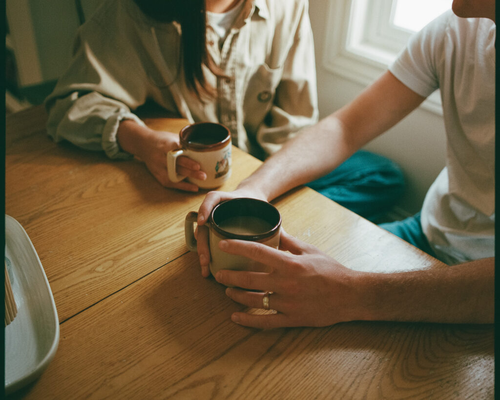 couple with coffee at home on film