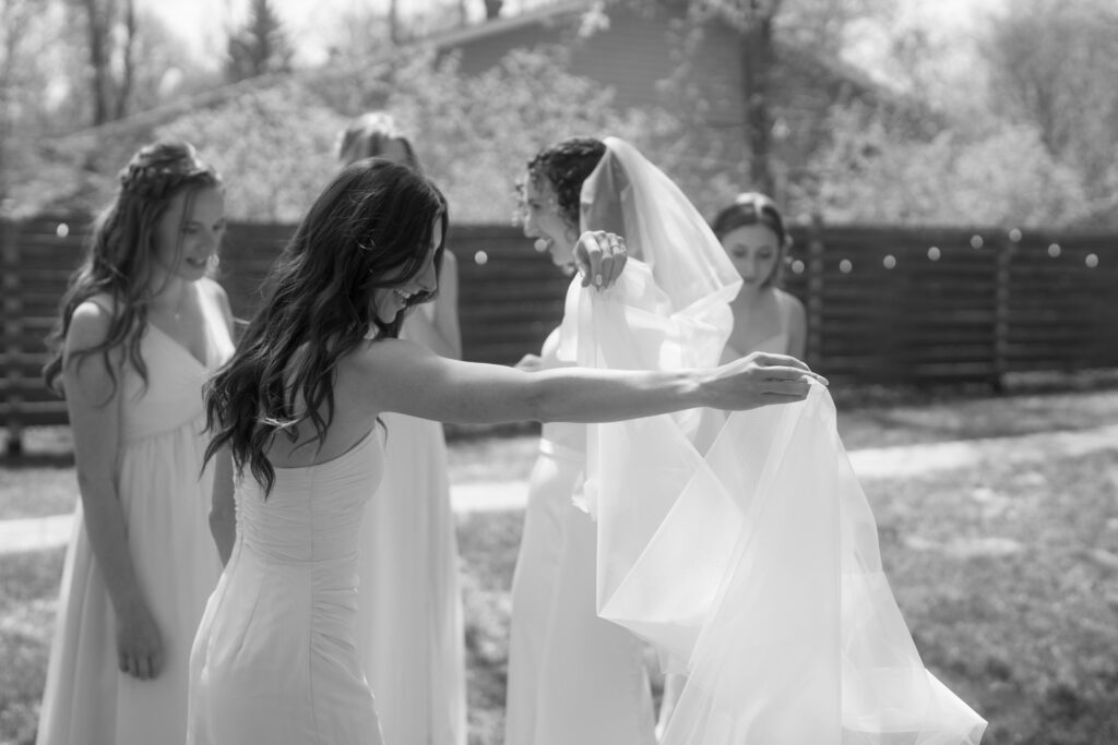 bridesmaids first look in backyard wedding