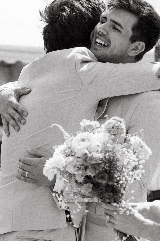 black and white candid photos after backyard wedding ceremony