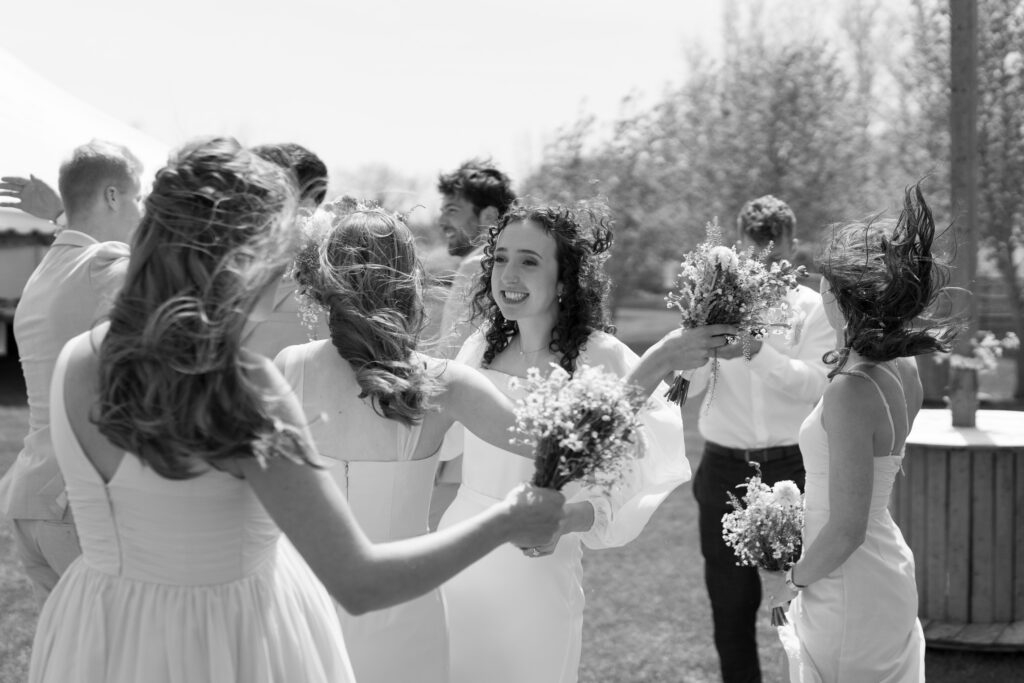 black and white candid photos after backyard wedding ceremony