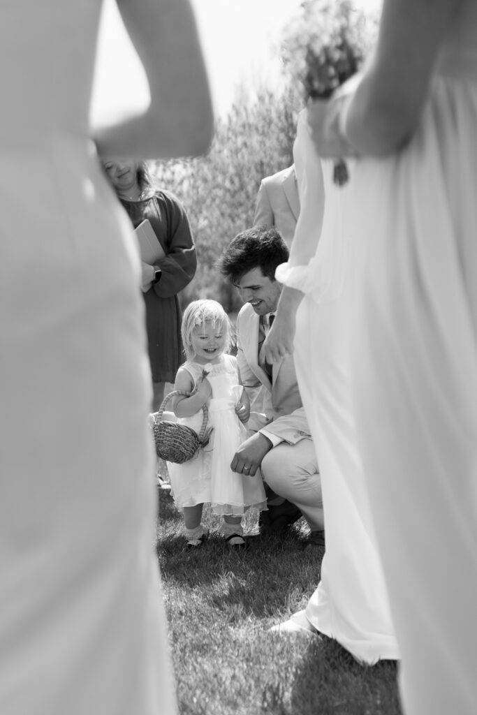 black and white candid photos after backyard wedding ceremony