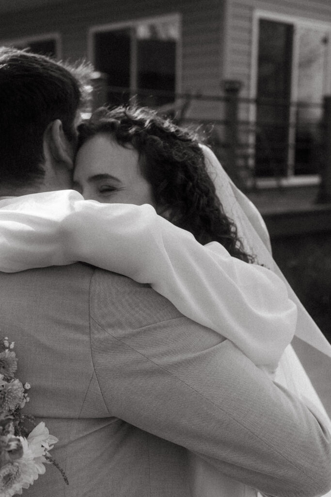 candid black and white photo of bride and groom