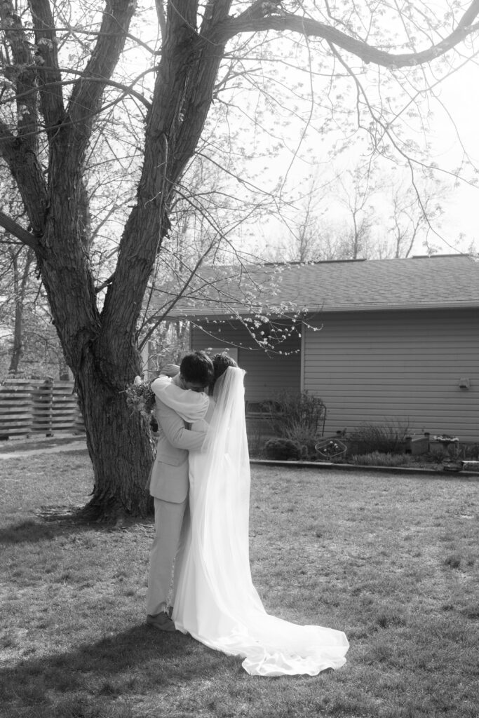 candid black and white photo of bride and groom