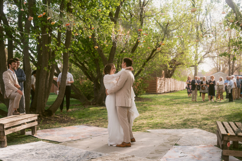 first dance of bride and groom in backyard wedding