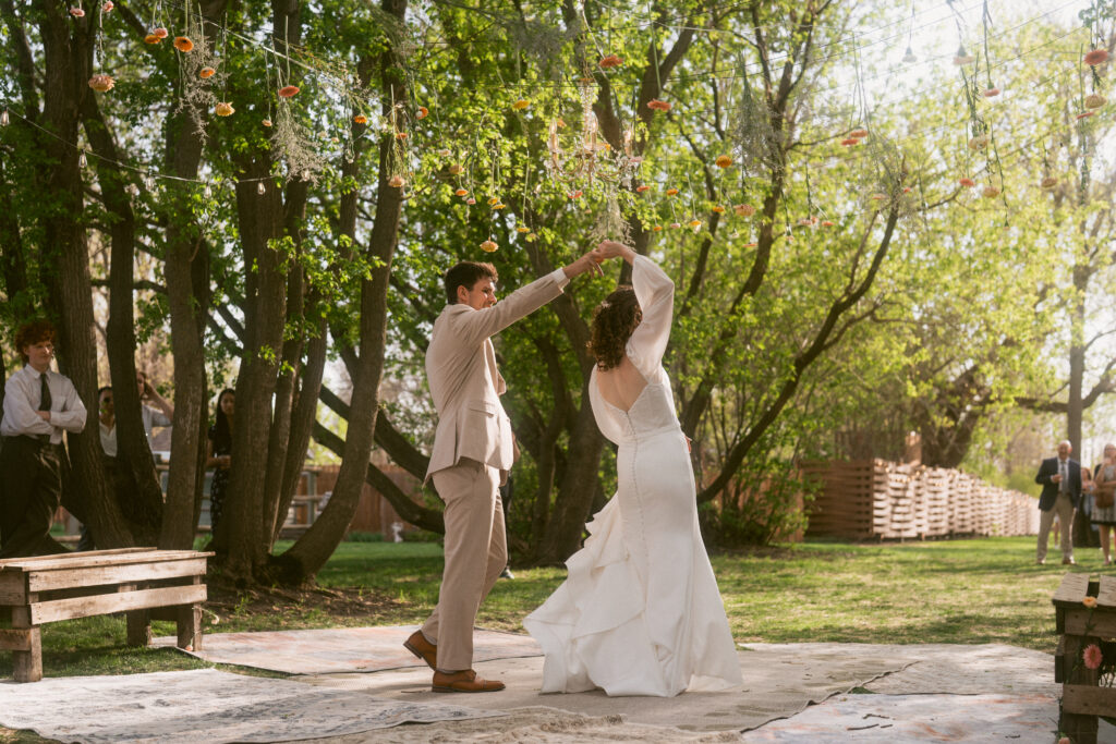 first dance of bride and groom in backyard wedding