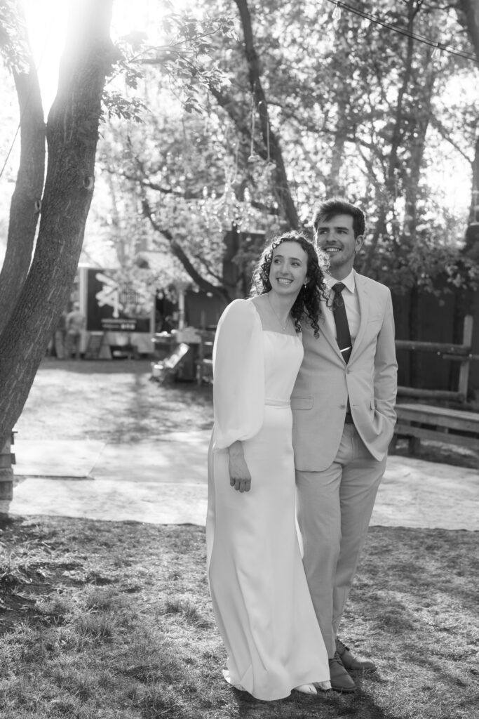 black and white candid photo of bride and groom