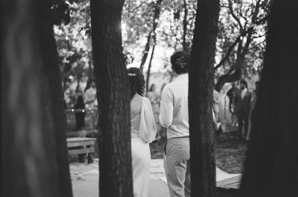 black and white candid photo of bride and groom
