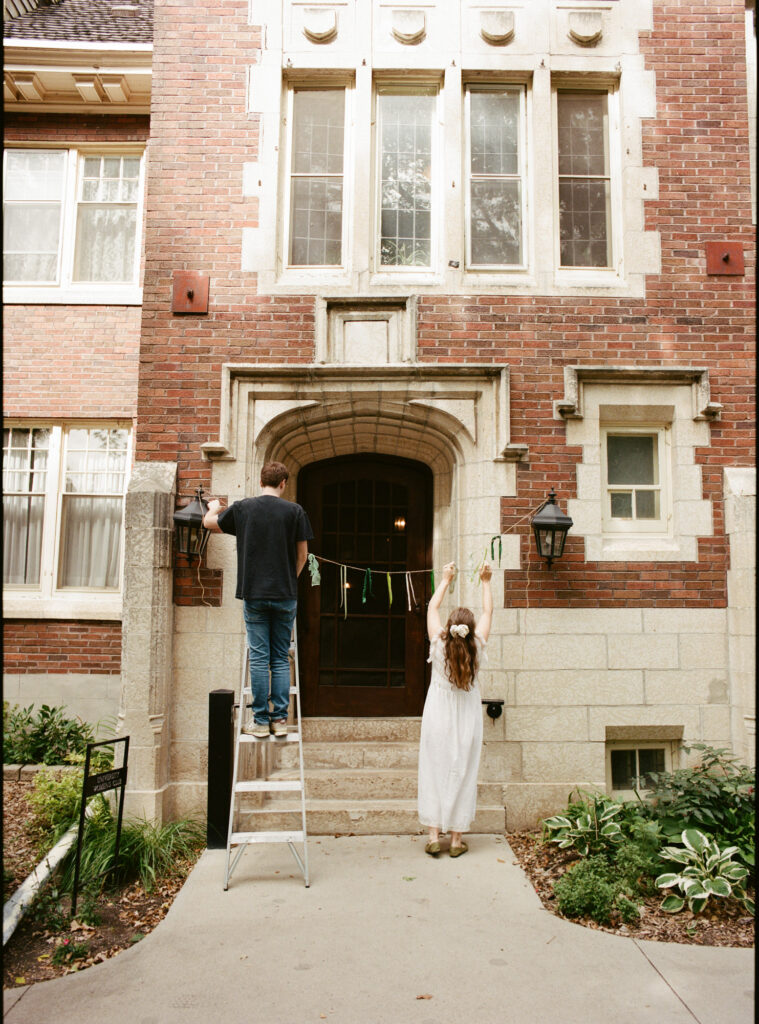 documentary-style photo of bride setting up wedding