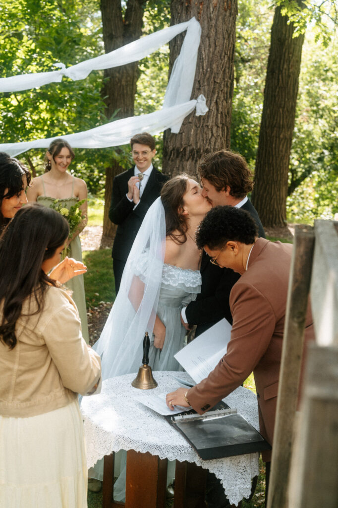candid documentary-style wedding photography of bride and groom signing papers