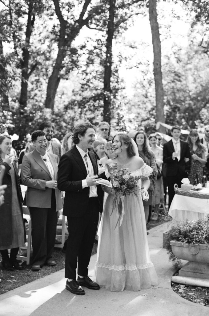 bride and groom reacting to speeches. Documentary-style photography