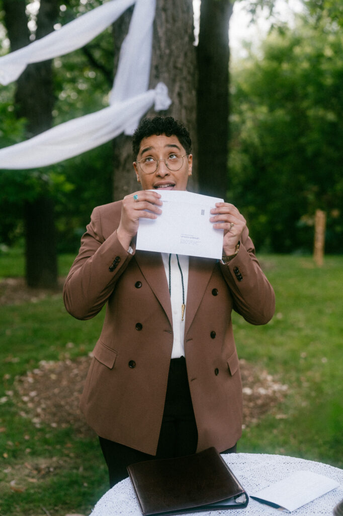 documentary-style wedding photo of officiant