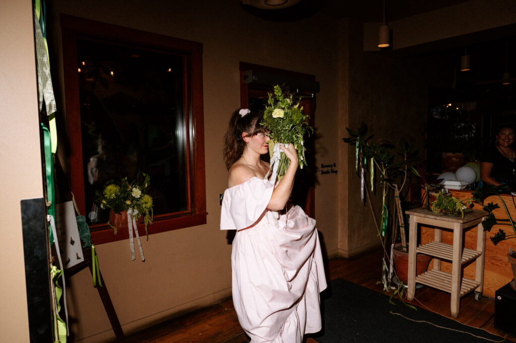 bride surprises groom with haircut on wedding day. Candid documentary-style wedding photo