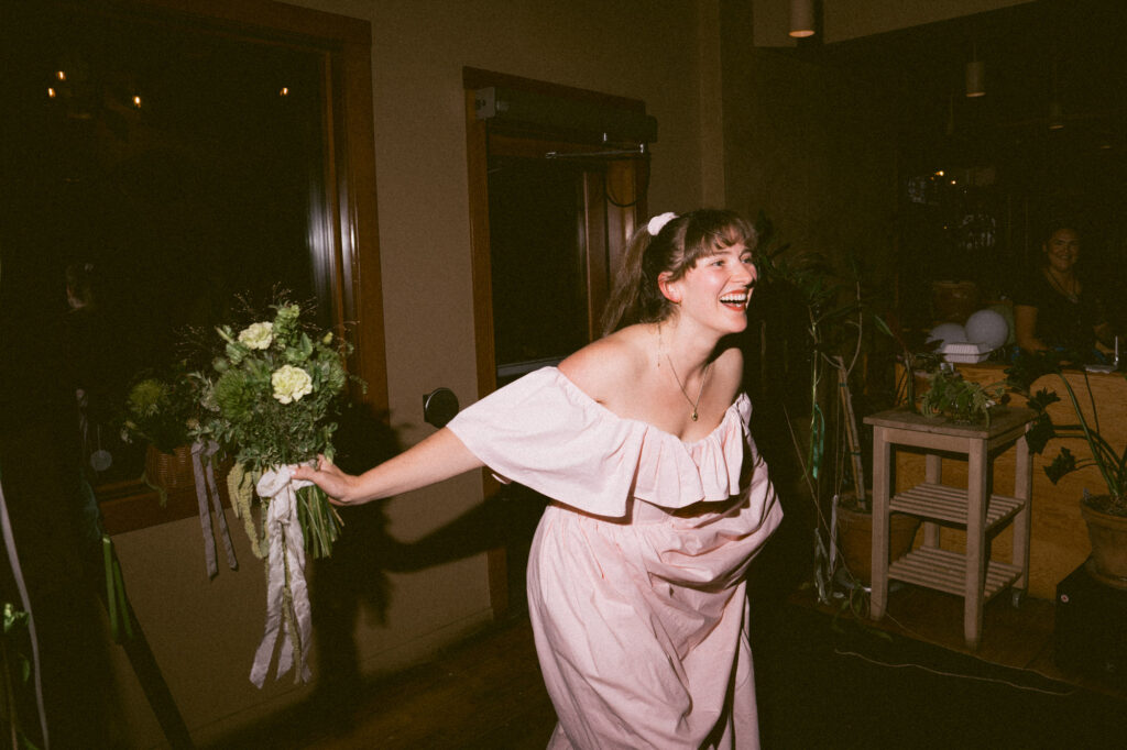 bride surprises groom with haircut on wedding day. Candid documentary-style wedding photo