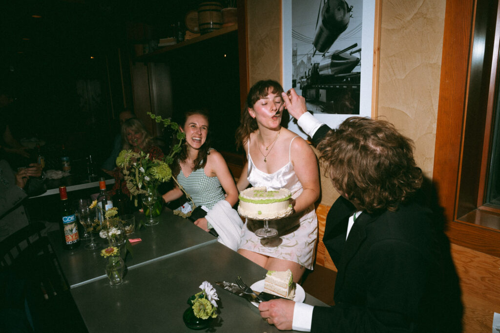 wedding cake cutting documentary style photo
