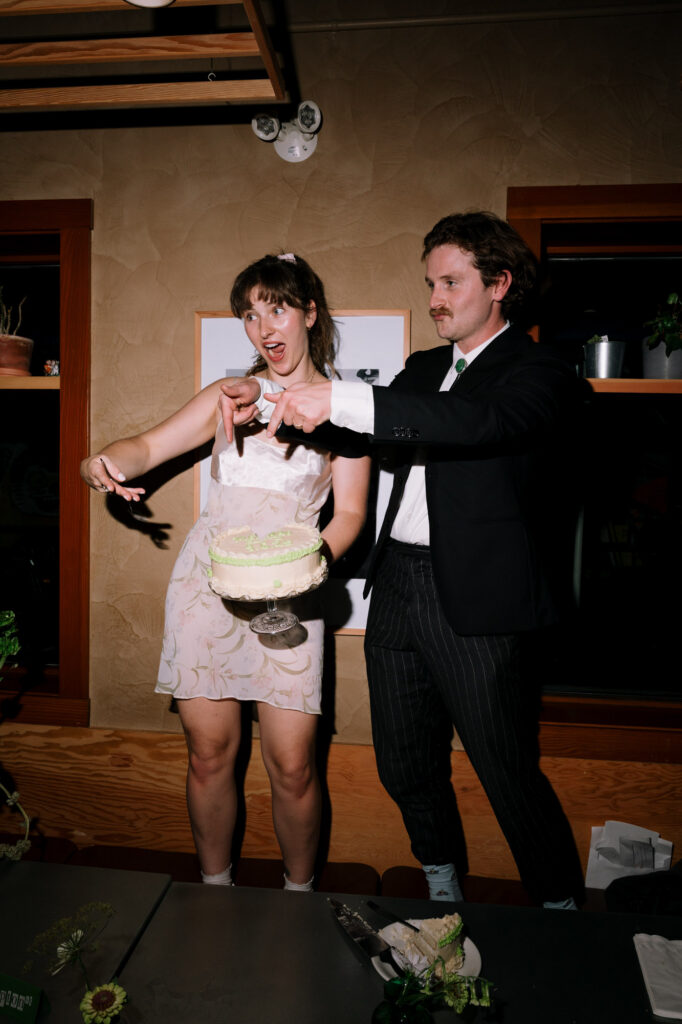 wedding cake cutting documentary style photo