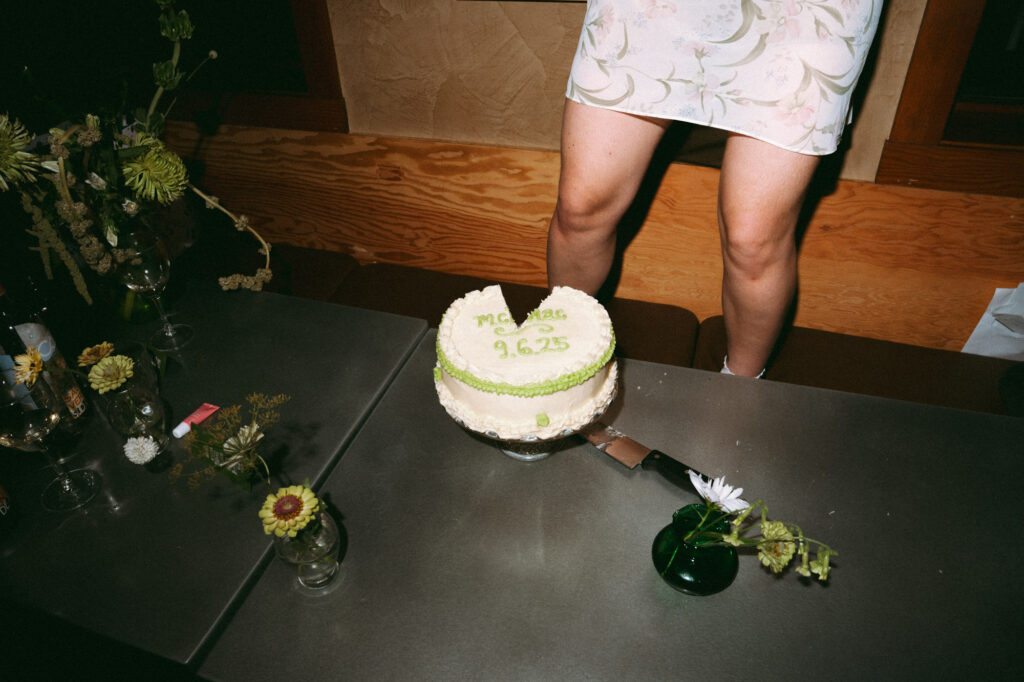wedding cake cutting documentary style photo