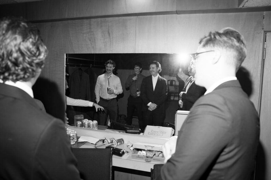 documentary-style groomsmen getting ready photo
