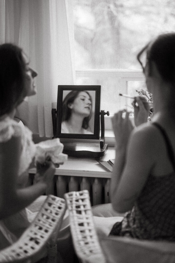 documentary-style photo of bride getting ready with sister