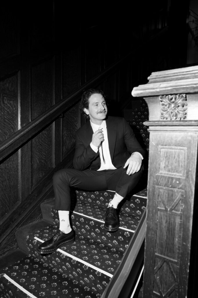 editorial-style photo of groom on wedding day