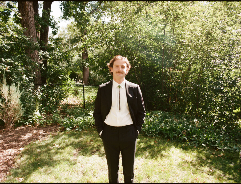 editorial-style photo of groom on wedding day