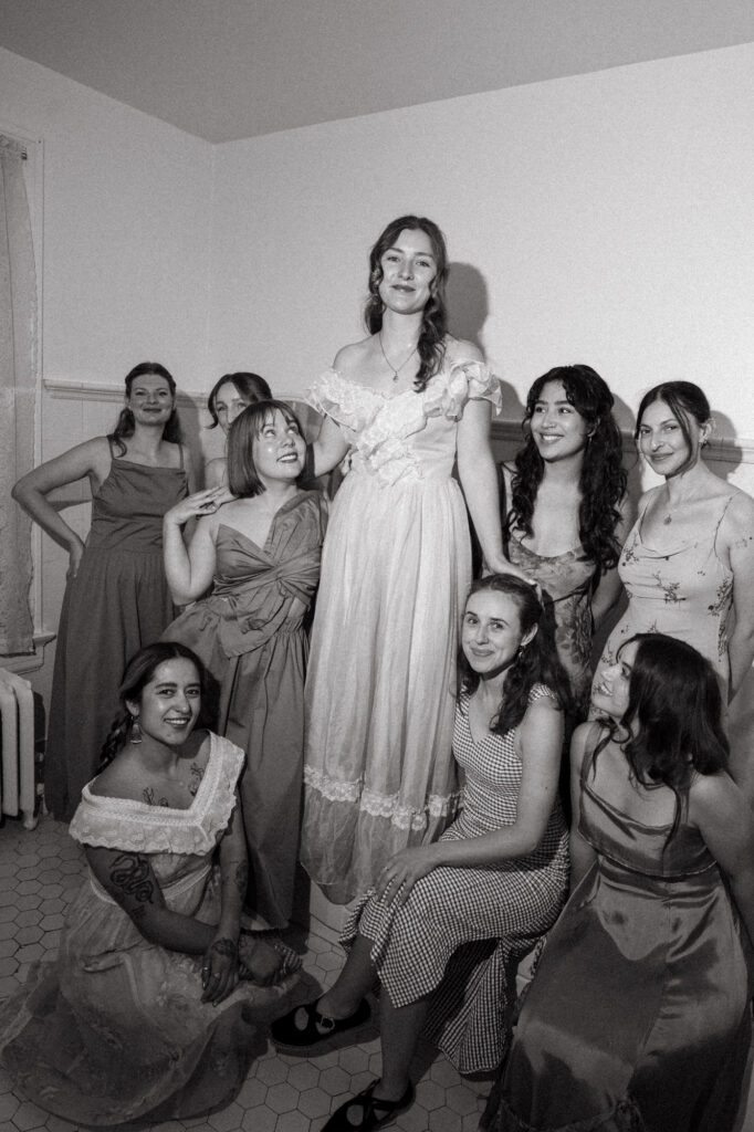 editorial-style photo of bride and bridesmaids on wedding day