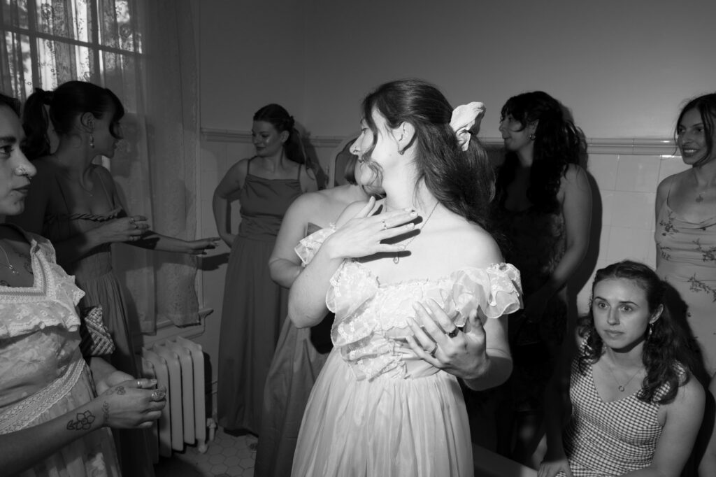 documentary-style photo of bride and bridesmaids on wedding day