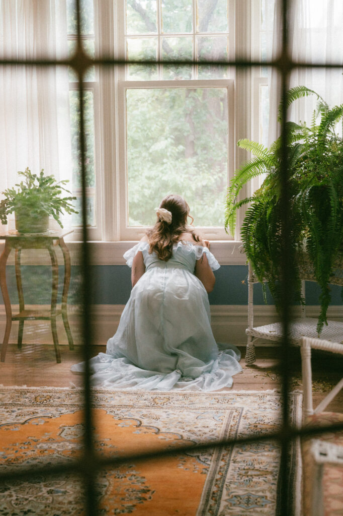documentary-style photo of bride on wedding day waving to guests
