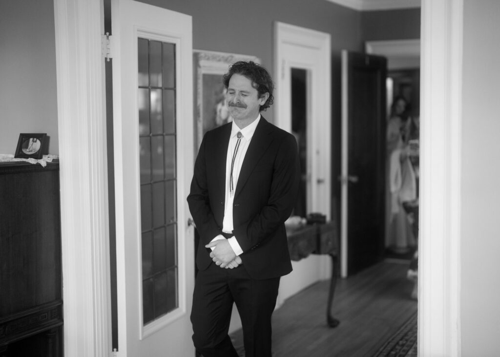 documentary-style photo of bride and groom first look on wedding day