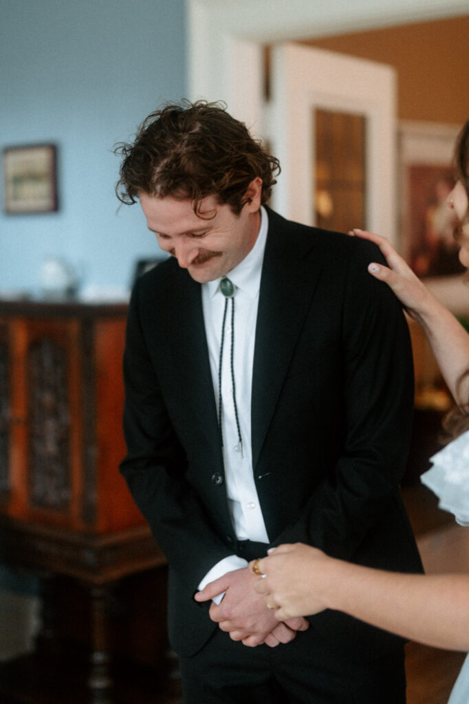 documentary-style photo of bride and groom first look on wedding day