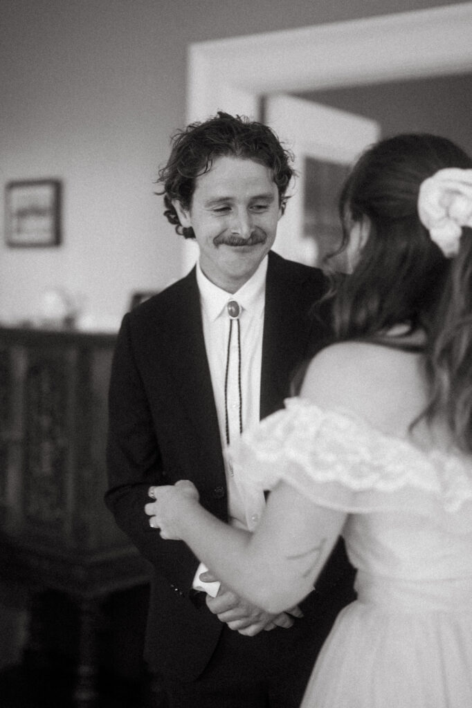 documentary-style photo of bride and groom first look on wedding day